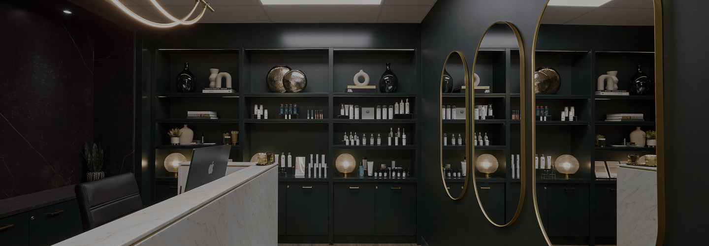 Reception area with skincare product shelves at the symm label in Calgary