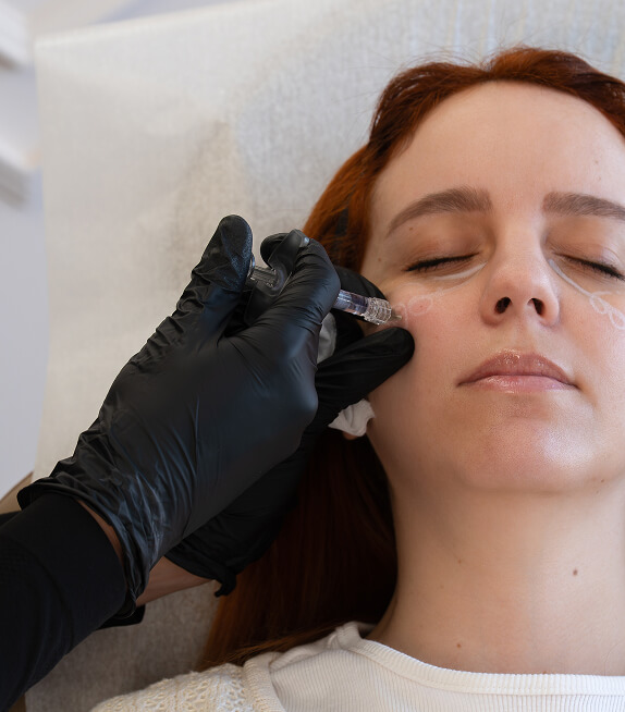 Injector performing cheek injection treatment at the symm label in Calgary