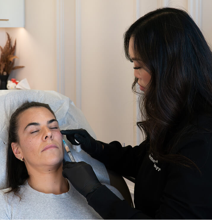 Practitioner performing PRF injection in cheek area at the symm label in Calgary