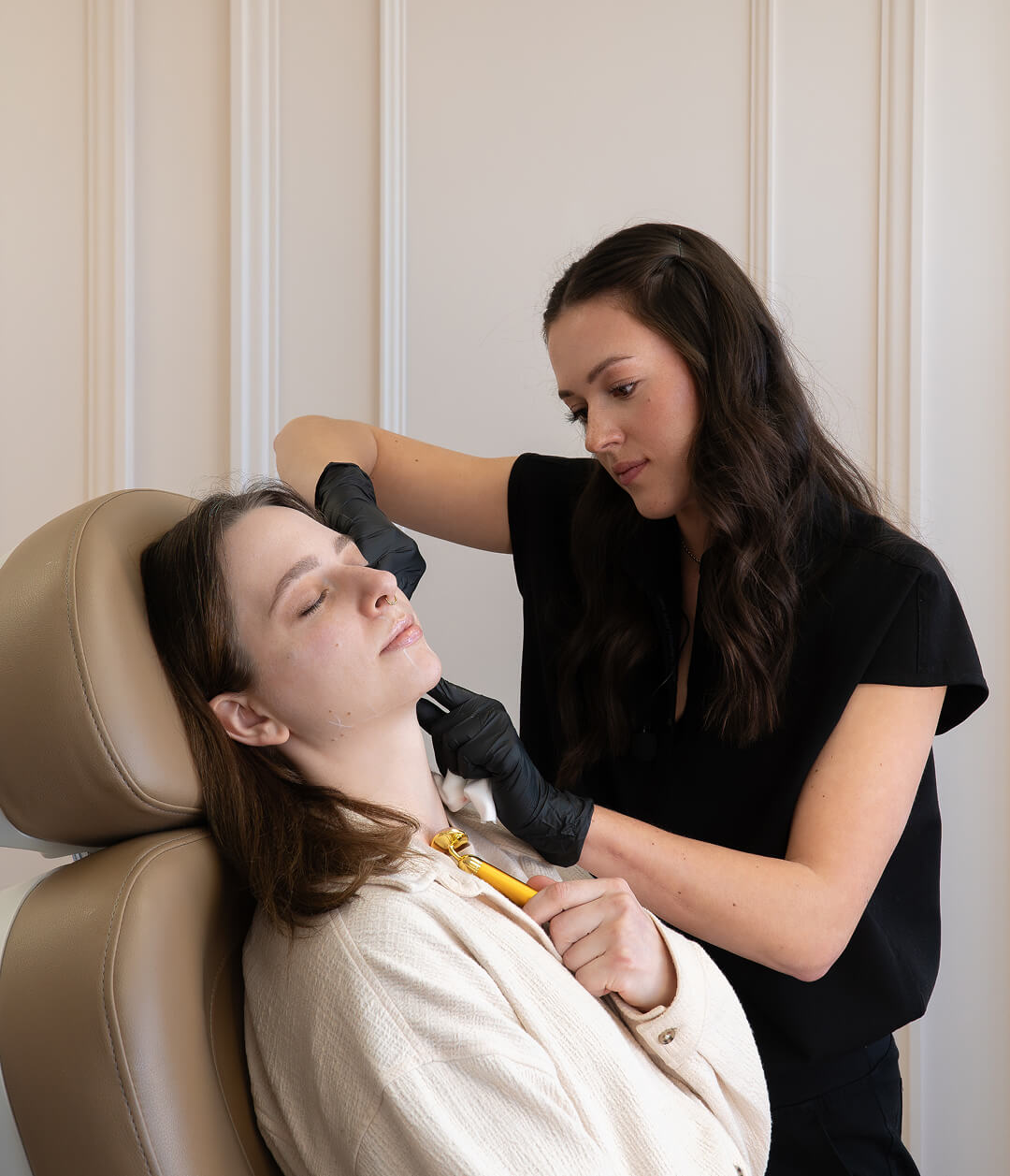 Practitioner performing injection treatment on client at the symm label in Calgary