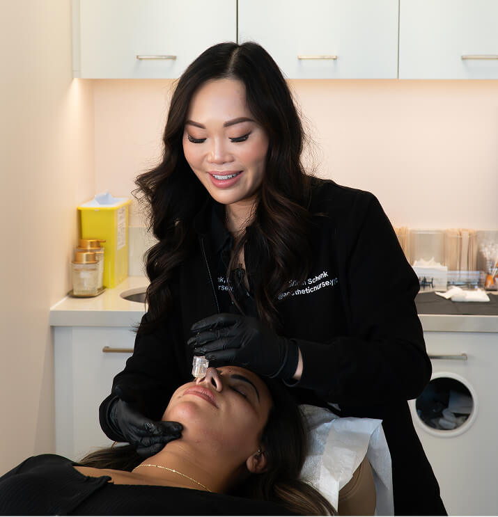 Provider performing ultra smooth pore mesotox treatment on client at the symm label in Calgary