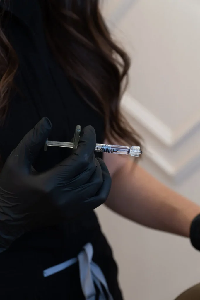 nurse injector holding microneedling device 