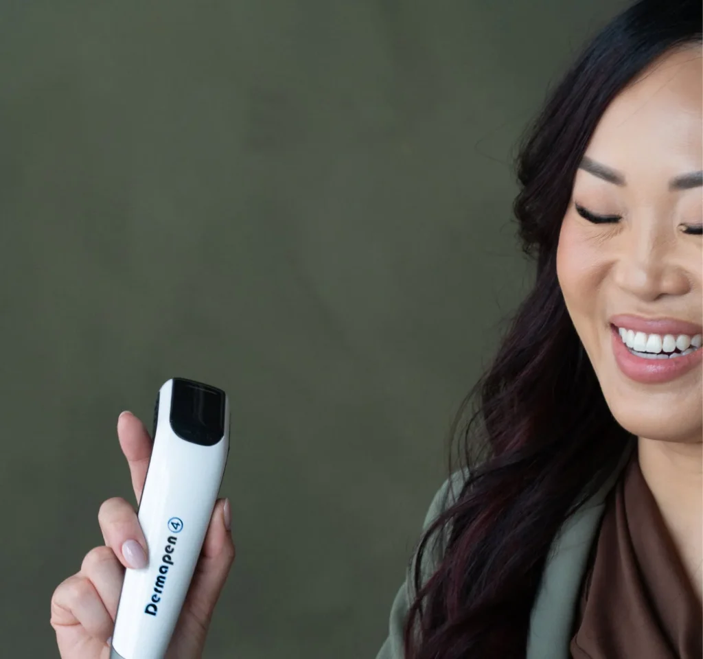 Nurse injector holding a Dermapen microneedling device during a masseter Botox consultation in Calgary